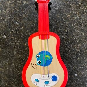 The Baby Einstein & Hape Sing & Strum Magic Touch Ukulele Toy